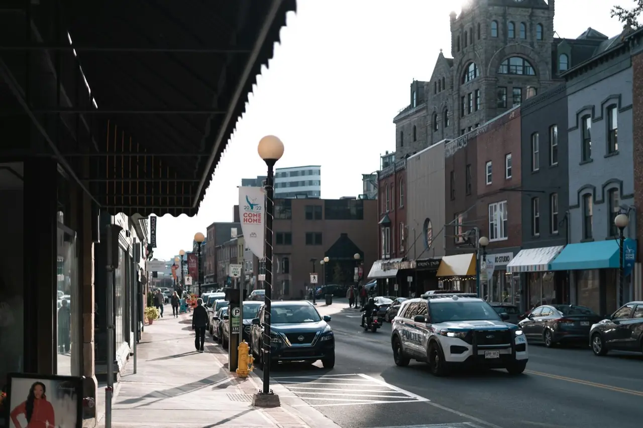 Downtown Kingston, Ontario main street with heritage limestone buildings — crowd control services in Kingston